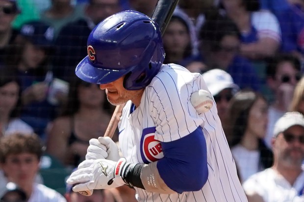 Chicago Cubs' Yan Gomes is hit by a pitch during the fifth inning of a baseball game against the Cincinnati Reds, Friday, May 31, 2024, in Chicago. (AP Photo/David Banks)