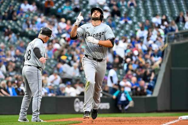 White Sox shortstop Paul DeJong points skyward after hitting a solo home run during the third inning against the Mariners on June 11, 2024, at T-Mobile Park in Seattle. Alika Jenner/Getty)