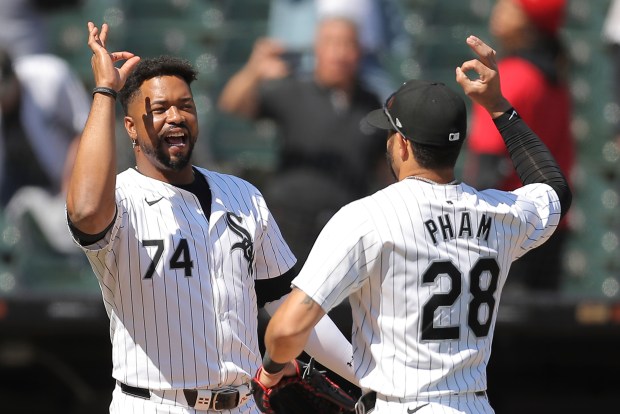 Chicago White Sox's Eloy Jiménez, left, celebrates with Tommy Pham after the White Sox defeated the Washington Nationals in a baseball game, Wednesday, May 15, 2024, in Chicago. (AP Photo/Melissa Tamez)