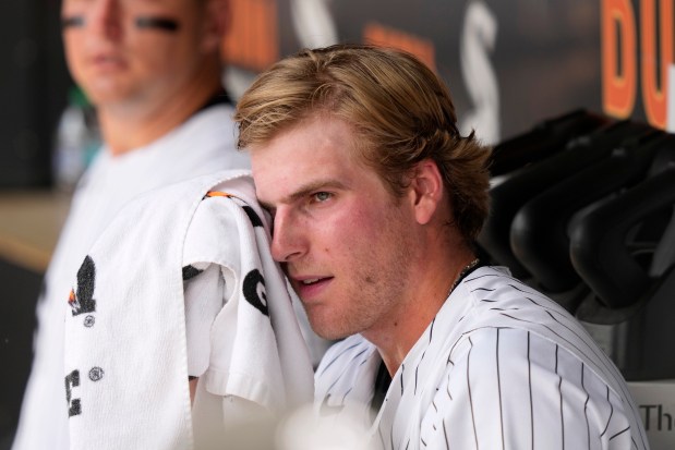 White Sox starter Jonathan Cannon wipes his face in the dugout after the first inning against the Rockies on June 29, 2024, at Guaranteed Rate Field. (Charles Rex Arbogast/AP)
