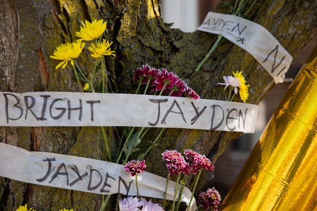 A memorial outside the home of Jayden Perkins, 11, who was stabbed to death in his home on March 13, 2024. (Vincent Alban/Chicago Tribune)