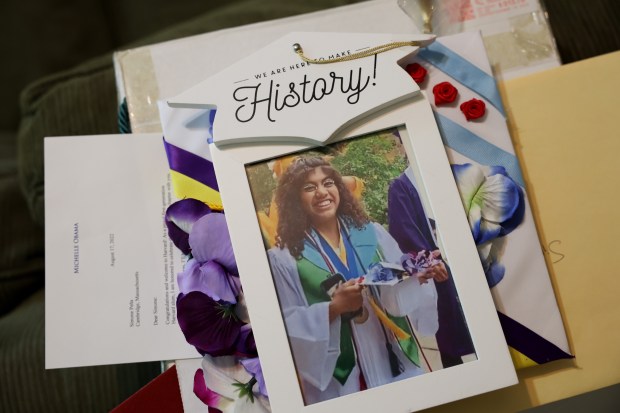 Mementos from high school are displayed at Simone Peña Hernandez's family home Thursday, June 13, 2024, in Chicago. An incoming junior at Harvard University who immigrated to Chicago from Mexico without documentation, Simone, 20, hopes to find stable work after graduation with a dual concentration on government and visual art while pursuing a masters or law degree. She recently spoke to government and business leaders to champion a recent state resolution that calls for action from the White House to give work permits to longtime undocumented workers and recent arrivals alike. (John J. Kim/Chicago Tribune)