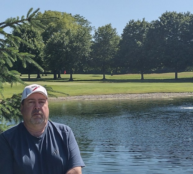 Frank Raczon, a Sleepy Hollow resident who worked at Bonnie Dundee Golf Course in Carpentersville in the 1980s when he was in high school and college, stands near the pond at the course's 6th hole. (Mike Danahey/The Courier-News)