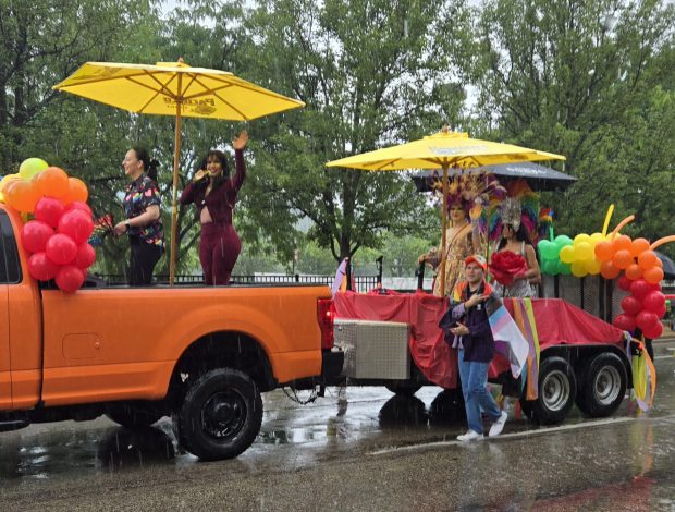 A Selena impersonator waves to the Elgin Pride Parade crowd Saturday from a float sponsored by the newly opened El Patio restaurant in downtown Elgin. (Gloria Casas/The Courier-News)