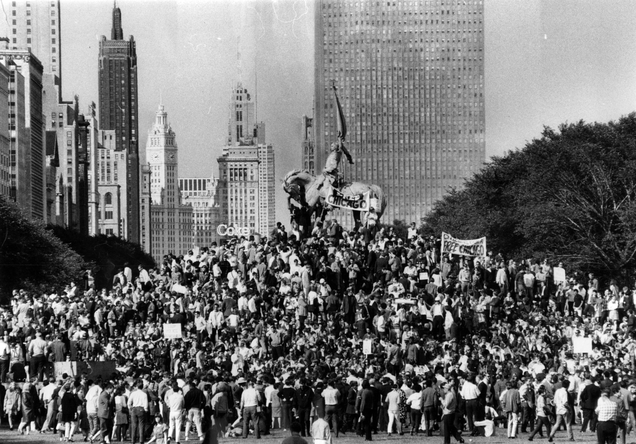 Demonstrators gather around the General Logan monument in Grant Park...