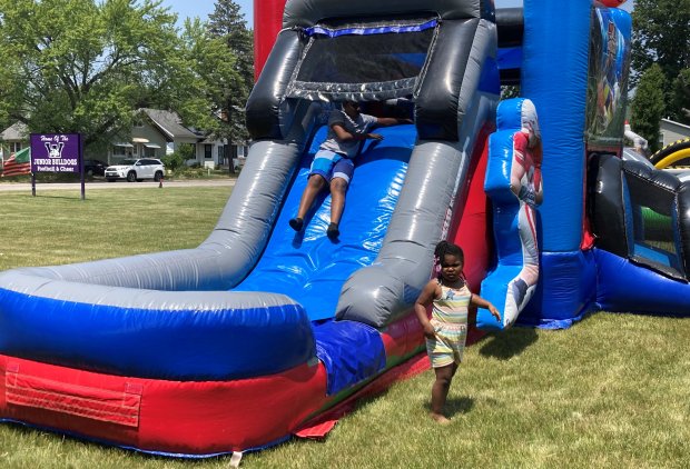 Children play at a bouncy house during a Juneteenth youth celebration Monday in Waukegan.