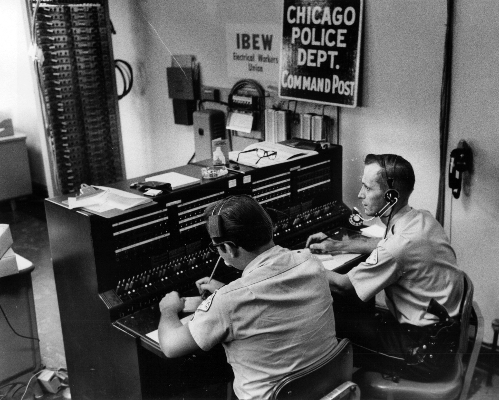 Fred Susinski, a police cadet, and patrolman Bernard Dorken work...