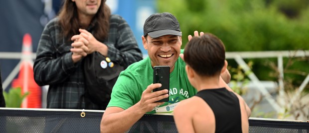 With the left hand up for a congratulatory high five is Alex Vieyra of Joliet, the parent of 5K first finisher No. 3681 Emiliano Vieyra, 13, a rising eighth-grader from Joliet, during the 5K portion at the Highland Park Run Half Marathon, 5K and 1 Mile Run on June 2, 2024 in downtown Highland Park.