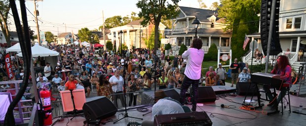 Center, Chadd Wickert of Vernon Hills, lead singer with the band Of Perception-A Doors Tribute band performs at the Friday opener of the Historic Downtown Long Grove Strawberry Fest on June 21, 2024. (Karie Angell Luc/Lake County News-Sun)