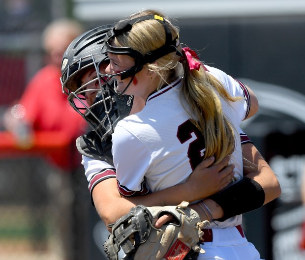 Antioch pitcher Jacey Schuler (25) and catcher Addison Webb (22) hug after the last out of the game. Antioch defeated Waterloo 2-0 in the Class 3A state semifinals at Louisville Slugger Sports Complex in Peoria, Friday, June7, 2024. (Rob Dicker / News Sun).