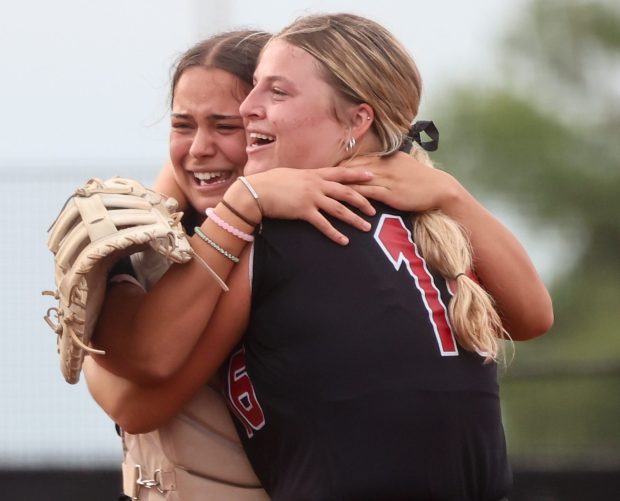 Mundelein's Claire Connelly (16) celebrates with teammate Karina Benes (12) after winning the Class 4A Rosemont Supersectional game against Huntley on Monday, June 3, 2024. (Troy Stolt/for the News-Sun)