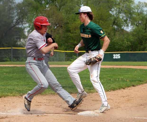 Waubonsie Valley's Owen Roberts makes the out at first during the boys baseball game against Glenbard East Saturday, May 4, 2024, in Aurora. (James C. Svehla/for the Naperville Sun)