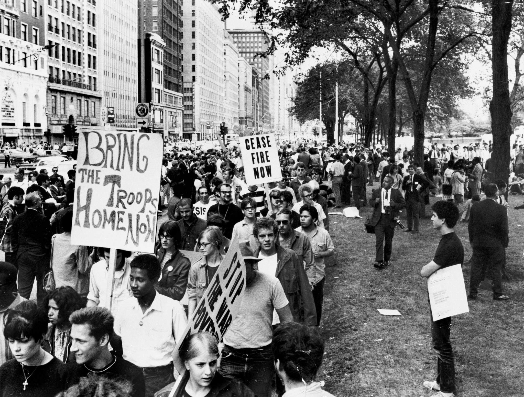 Anti-Vietnam War demonstrators march down Michigan Avenue in one of...