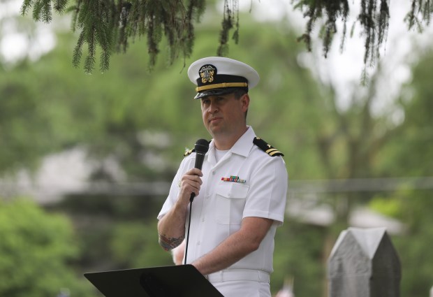 Lt. Matthew Page, Staff Chaplain of Recruit Training Command at Naval Station Great Lakes, speaks during a Memorial Day ceremony at Knopf Cemetery in Buffalo Grove on Monday, May 27, 2024. (Trent Sprague/for the Pioneer Press)