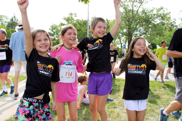 9-year-old Evanston residents Maya Breitbach, Tilly Levey, Charlie Krouse and Sadie Krouse joined the Ricky Byrdsong Memorial Race Against Hate for the first time this year. (Gina Grillo/Pioneer Press)