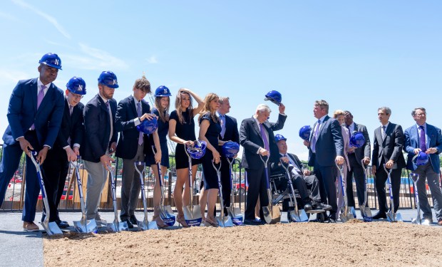 Members of the Ryan Family are joined by the guest speakers during the Ryan Field groundbreaking ceremony for photos at the site of the ongoing construction in Evanston on Monday, June 24, 2024. (Nate Swanson/for the Pioneer Press)