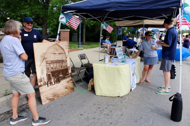 The Glenview History Museum Booth offered games relating to the history of Glenview and the transformation of businesses, past present and future during Glenview Summer Fest 2024. (Gina Grillo for the Pioneer Press)