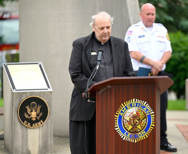 Father David Ryan with St. Francis de Sales Parrish gives the closing prayer at Lake Zurich Memorial Day service after the parade, Monday, May 27, 2024. (Michael Schmidt/for the Pioneer Press)