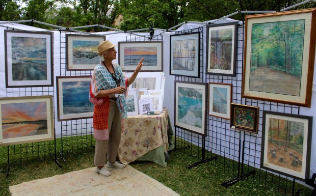 Omaha Nebraska-based musician and artist Patty Ritchie shares her soft pastel series, Peace of Sky, during Art in the Village sponsored by the North Shore Art League in Hubbard Woods Park this weekend. (Gina Grillo/Pioneer Press)