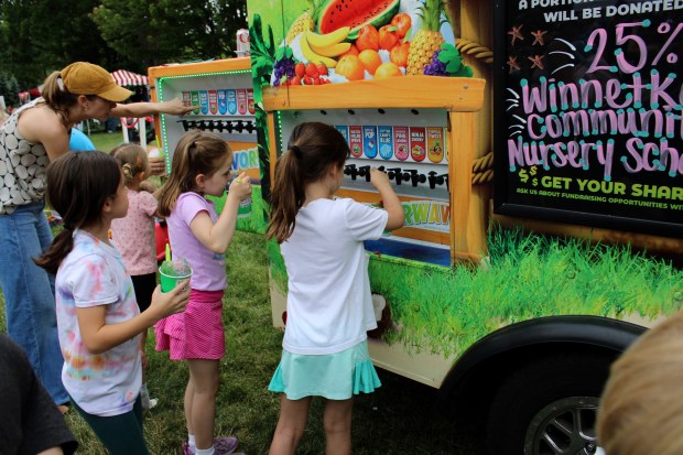 Attendees of the annual Winnetka Children's Fair this year could pick up favorite carnival treats like make-your-own Kona Ice Snow Cones. (Gina Grillo/Pioneer Press)