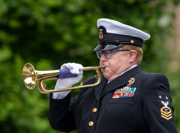 Master Chief Mary Arvidson plays Taps during a Memorial Day ceremony at Scoville Park in Oak Park on Monday, May 27, 2024. (Nate Swanson/for the Pioneer Press)