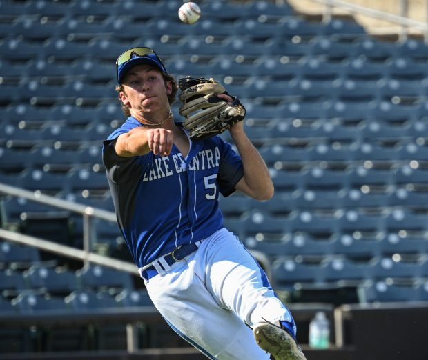 Lake Central third baseman Ryder Fernandez fires the ball to first to catch a Chesterton runner during the Class 4A regional on Monday, June 3, 2024. (Kyle Telechan/for the Post-Tribune)