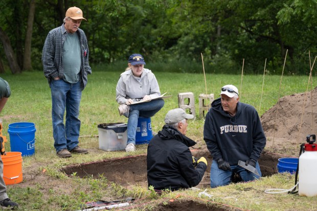 Participants measure, observe, take notes, and excavate during the annual Collier Lodge site archaeological dig on on Monday, June 10, 2024. (Kyle Telechan/for the Post-Tribune)