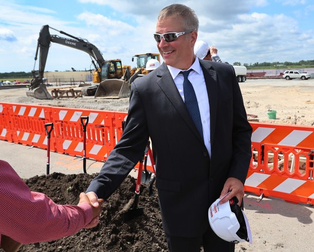 Jeromy Montesano, president of Wingtip Aviation, greets a worker during a groundbreaking ceremony at the Gary/Chicago International Airport for its new $12 million dollar aircraft hanger on Tuesday, June 18, 2024. (John Smierciak/Post Tribune)