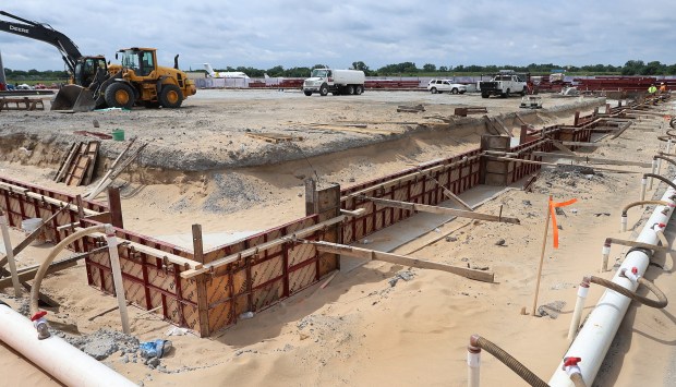Workers install foundation forms for new footings during a groundbreaking ceremony at the Gary/Chicago International Airport for its new $12 million dollar aircraft hanger on Tuesday, June 18, 2024. (John Smierciak/Post Tribune)