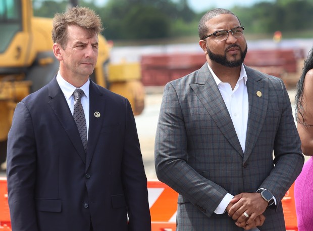 Congressman Frank MrVan and Gary Mayor Eddie Melton listen to speakers during a groundbreaking ceremony at the Gary/Chicago International Airport for its new $12 million dollar aircraft hanger on Tuesday, June 18, 2024. (John Smierciak/Post Tribune)