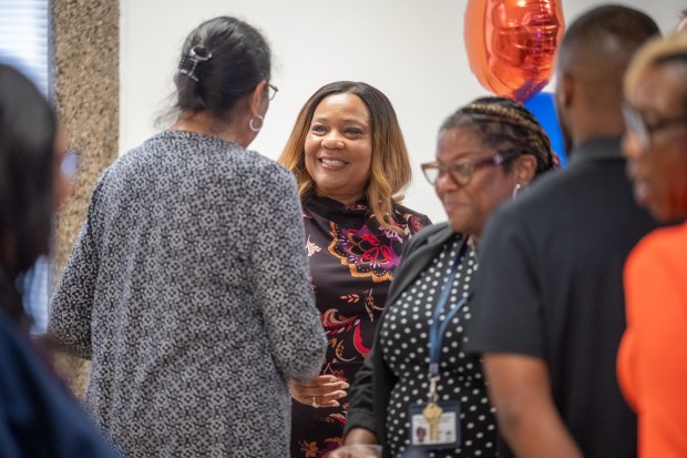 Newly-appointed Gary Community School Corporation superintendent Yvonne Stokes, center, speaks with visitors during a public meet and greet at the Gary Area Career Center on Tuesday, June 11, 2024. (Kyle Telechan/for the Post-Tribune)