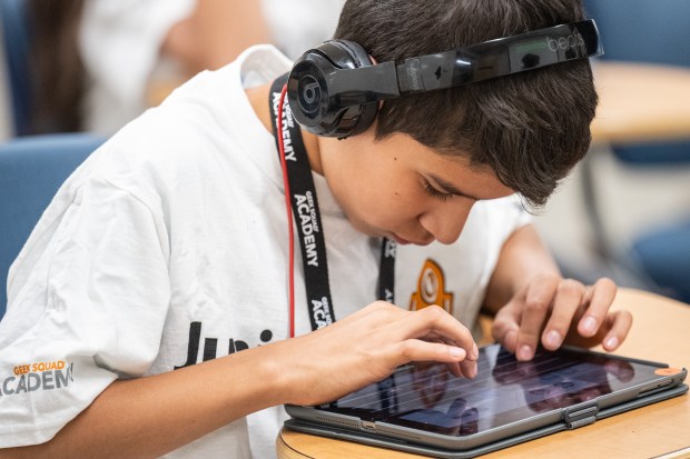 Jefferson Elementary student Ismael Orozco, 10, uses a tablet-based sequencer to make music during the Best Buy Geek Squad Academy event at Indiana University Northwest on Thursday, June 13, 2024. (Kyle Telechan/for the Post-Tribune)
