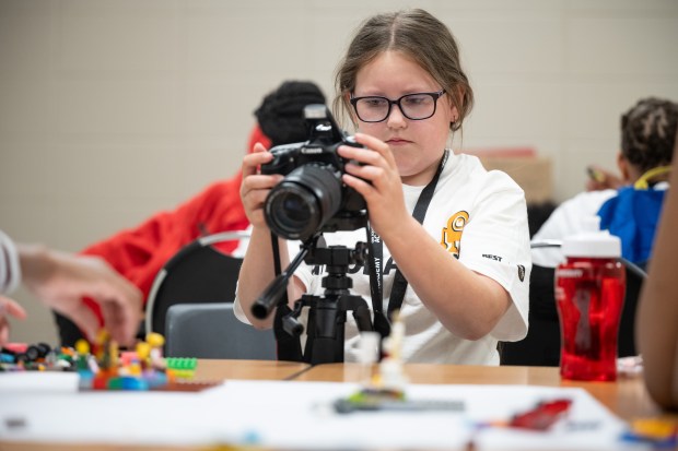 Hammond Academy of Science and Technology student Nora Lopez, 10, operates a camera as she participates in a stop-motion animation wrokshop at the Best Buy Geek Squad Academy event at Indiana University Northwest on Thursday, June 13, 2024. (Kyle Telechan/for the Post-Tribune)