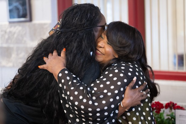 YWCA NWI Executive Director Caren Jones, on right, hugs Gary Common Council president Tai Adkins during a celebration of the completion of the YWCA NWI pool renovation project on Wednesday, June 19, 2024.(Kyle Telechan/for the Post-Tribune)