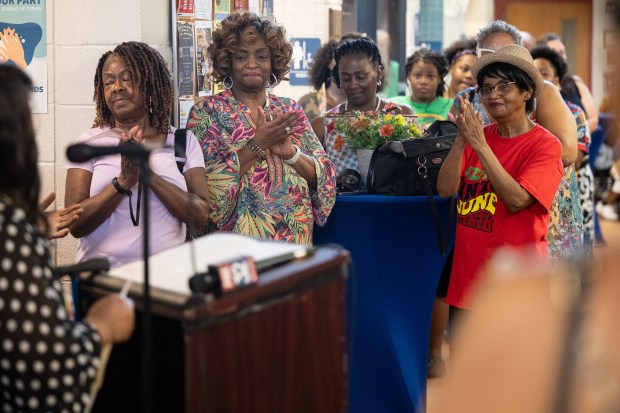 Visitors applaud during a celebration of the completion of the pool renovation project at the YWCA of Northwest Indiana on Wednesday, June 19, 2024.(Kyle Telechan/for the Post-Tribune)