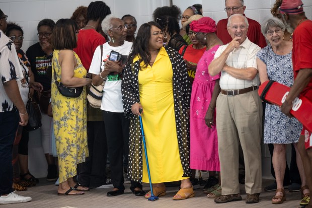 YWCA NWI Executive Director Caren Jones, center, smiles during a celebration of the completion of the organization's pool renovation project on Wednesday, June 19, 2024.(Kyle Telechan/for the Post-Tribune)