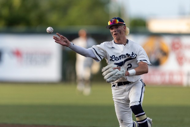 Lemont's Max Michalak throws to first for an out against De La Salle in the Class 3A Crestwood Supersectional at Ozinga Field in Crestwood on Monday, June 3, 2024. (Vincent D. Johnson/for the Daily Southtown)