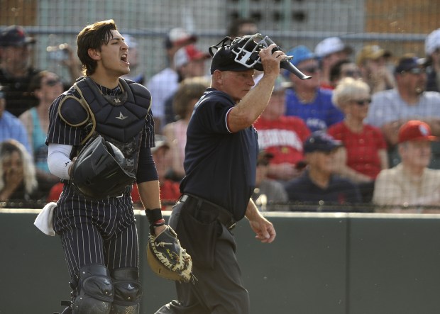 Lemont's catcher Noah Tomaras (5) directs the infield after a pop up by St. Rita during the Class 3A Evergreen Park Sectional final Friday, May 31, 2024 in Evergreen Park, IL. (Steve Johnston/Daily Southtown)