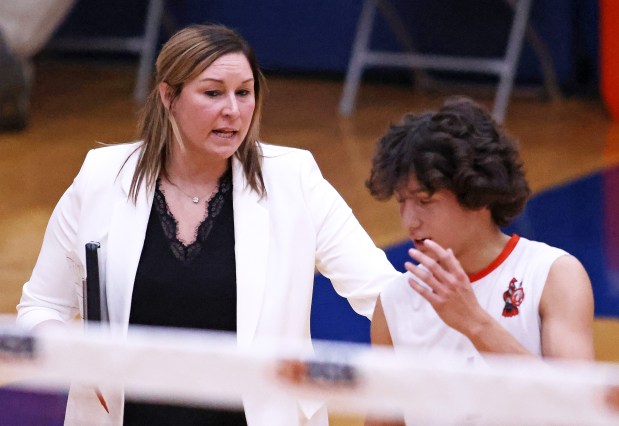 Lincoln-Way West's head coach Jodi Frigo and Andrew Flores (1) talk during a time out in a state quarterfinal match against York Friday, May 31, 2024 in Hoffman Estates. Lincoln-Way West lost, 25-17, 25-17.H. Rick Bamman / For the Daily Southtown