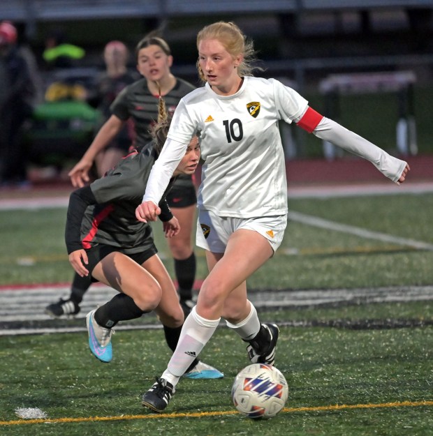 Andrew's Bella Kreydich dribbles the ball past Lincoln-Way Central's Maddie Krynski. Andrew defeated Lincoln-Way Central in girls soccer, Friday, April 19, 2024, in New Lenox, Illinois. (Jon Langham/for the Daily Southtown)