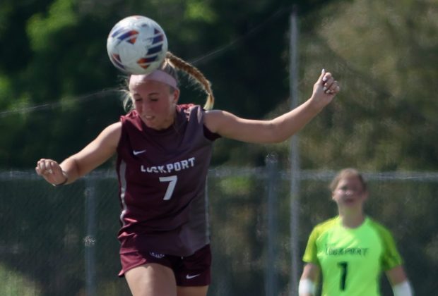 Lockport's Emma Czech (7) heads the ball during a game against Lincoln-Way East in Lockport on Saturday May 4, 2024. (Troy Stolt/for the Daily Southtown)