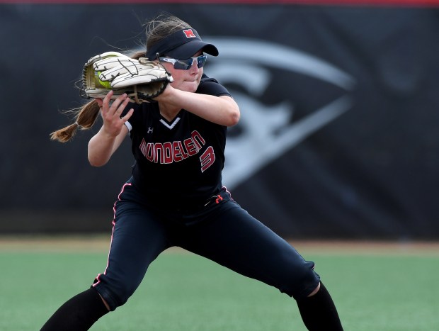 Mundelein's Taylor Pyke (3) gets a throw from her catcher and tries to tag out a runner. Marist defeated Mundelein 7-1 in the Class 4A state semifinals at Louisville Slugger Sports Complex in Peoria, Friday, June 7, 2024. (Rob Dicker / Daily Southtown)).