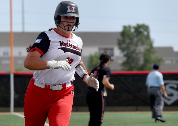 Marist's Gabriella Novickas (22) rounds third and heads to home. Marist defeated Mundelein 7-1 in the Class 4A state semifinals at Louisville Slugger Sports Complex in Peoria, Friday, June 7, 2024. (Rob Dicker / Daily Southtown)).