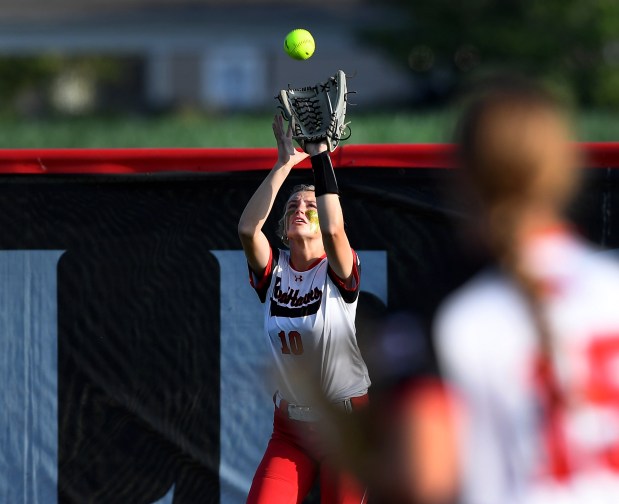 Marist's Camryn Lyons (10) battles the wind and makes a catch in the outfield. St. Charles North defeated Marist 7-2 in the Class 4A state championship at Louisville Slugger Sports Complex, Saturday, June 8, 2024(Rob Dicker / Daily Southtown)