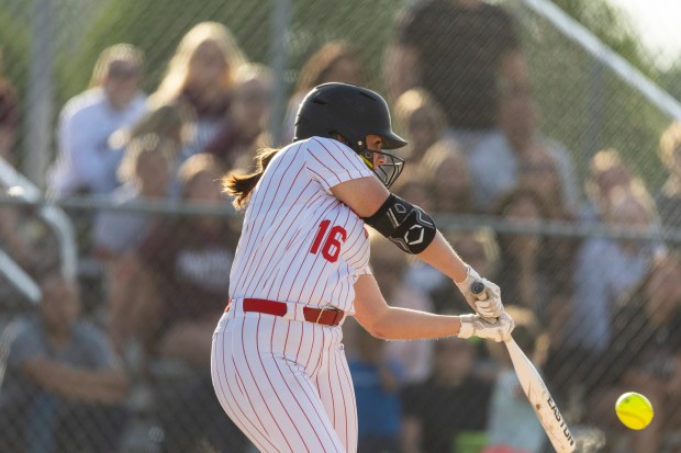 The Knights' Josephine Jager connects to drive in Isabella Olmos and win the Class 4A Lincoln-Way Central Sectional final over Lockport in New Lenox on Friday, May 31, 2024. (Vincent D. Johnson/for the Daily Southtown)