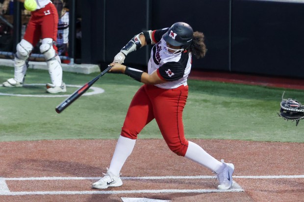 Marist's Soleil Tate (23) gets an RBI-single during the Class 4A Rosemont Supersectional game against Lincoln-Way Central on Monday, June 3, 2024. (Troy Stolt/for the Daily Southtown)