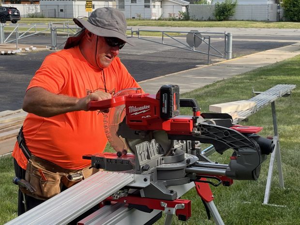 Frank Mallet of St. Michael Church in Orland Park does some sawing before the home building event June 22, 2024, in Alsip. (Jeff Vorva/for the Daily Southtown)
