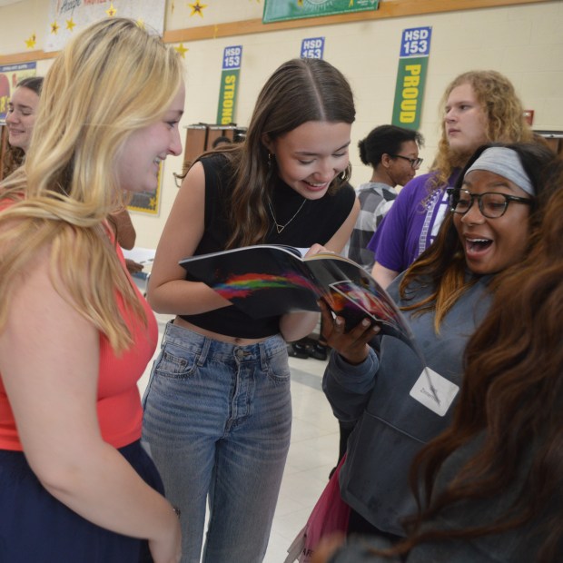 Members of the James Hart Middle School Class of 2020 reminisce May 24, 2024, during a reunion to make up for their eighth grade celebrations being curtailed by the COVID-19 pandemic. (Elementary District 153)