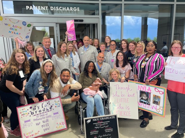 Cory and NaKeya Haywood celebrate Nyla leaving Silver Cross Hospital with members of "Nyla's Nation," the people who helped care for her. (Silver Cross Hospital)