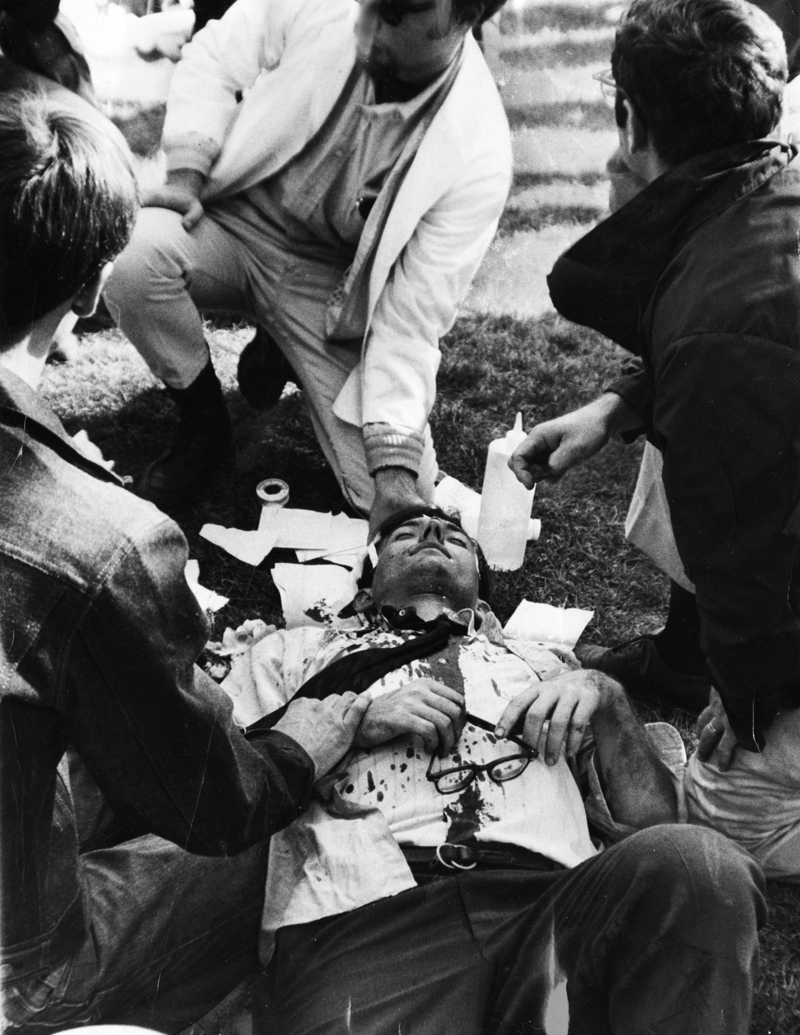 Felled by a rock thrown from ranks of protesters, a...